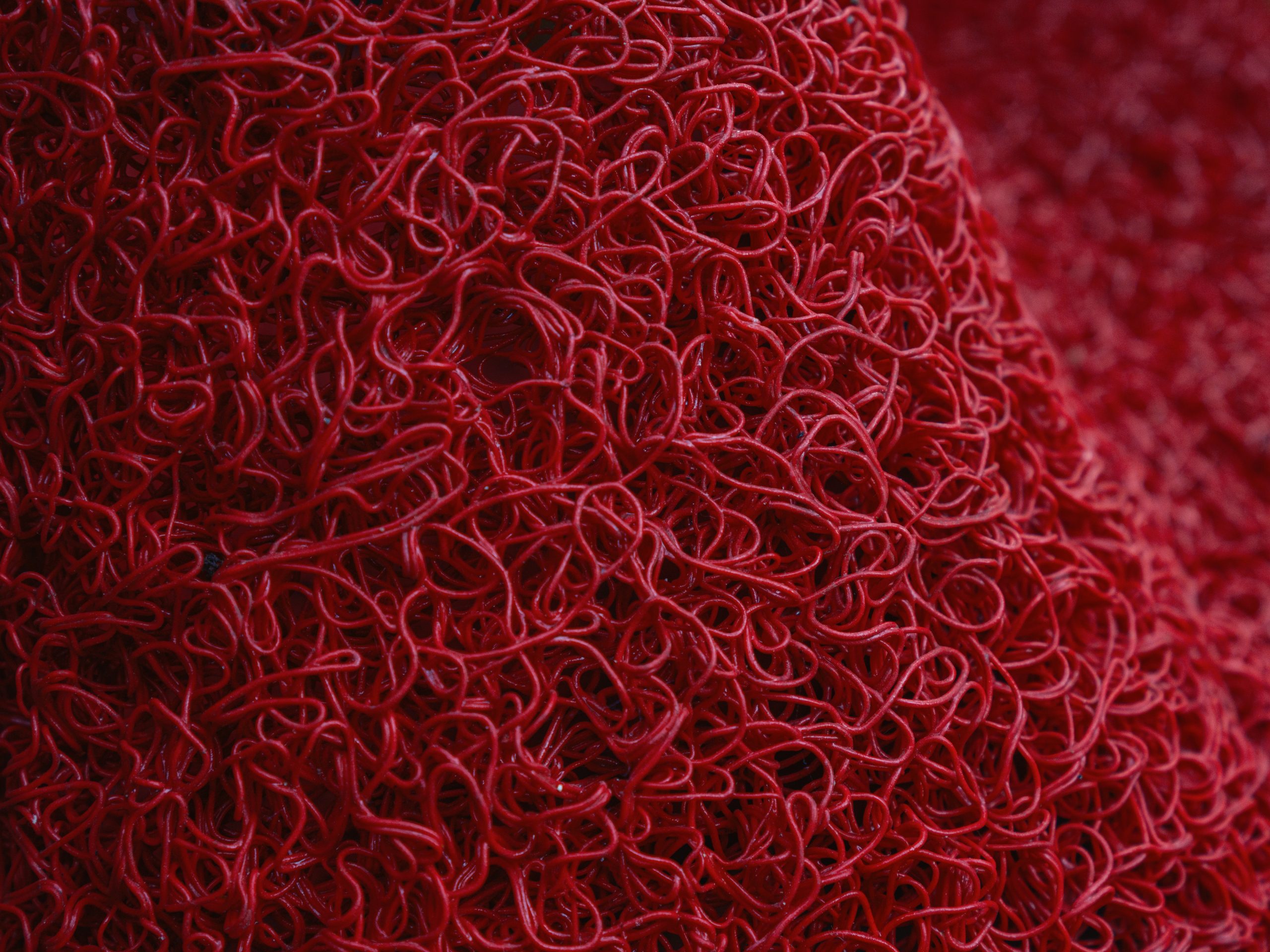 red synthetic carpet texture