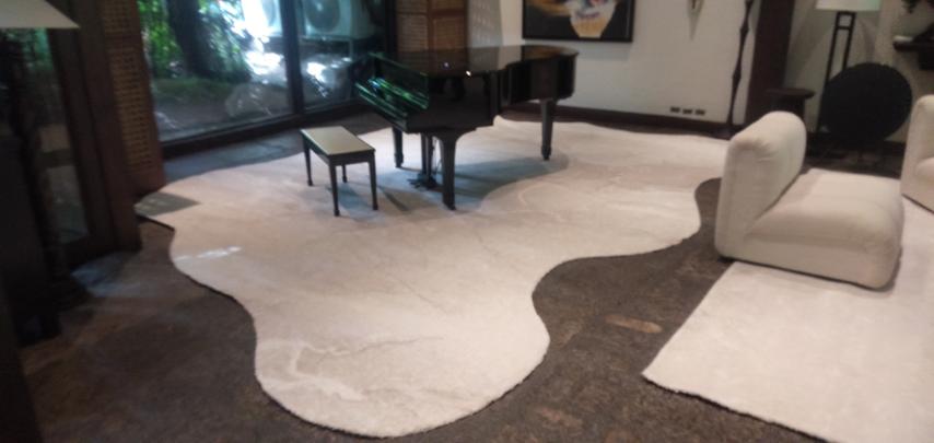 piano on top of odd shaped rug 